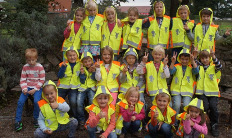 Children are seen even in the dark and grubby weather